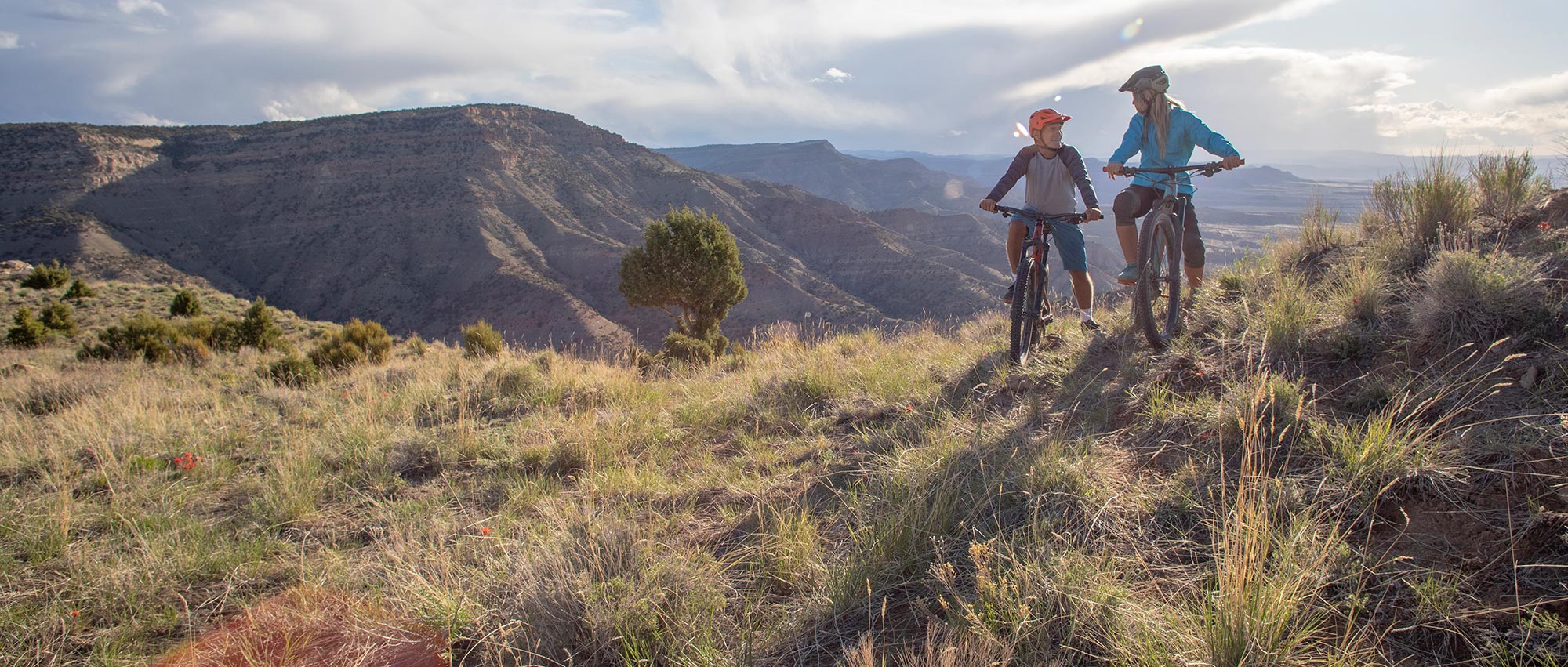 people mountain biking